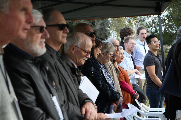 Hui members share in a waiata to back their manuhiri speakers at the Battle of Oraakau memorial site.