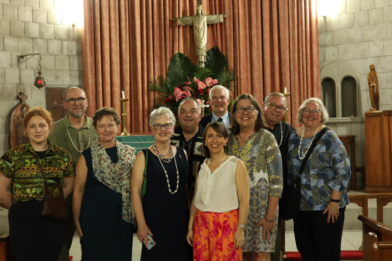 Members of the Compass Rose Society visiting the Anglican Church in Fiji take a picture in the sanctuary of Holy Trinity Cathedral Suva.