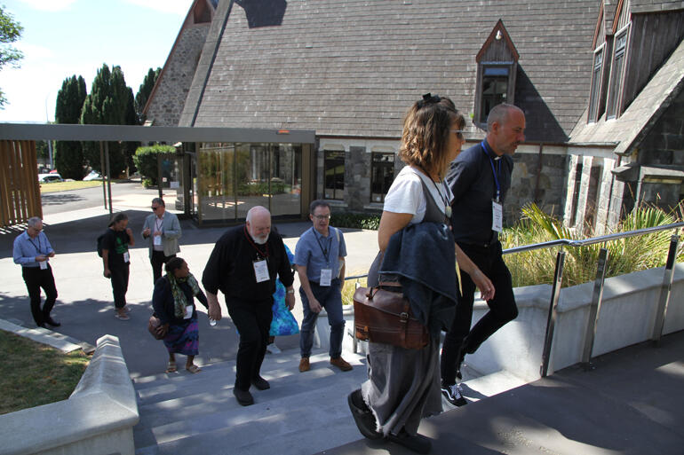 Fono members head from Te Whare Hononga into the Taranaki Cathedral graveyard to hear the stories of its occupants.