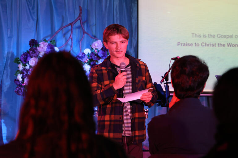 Evan Walters from St George's Epsom reads the Gospel at the opening service of The Abbey.